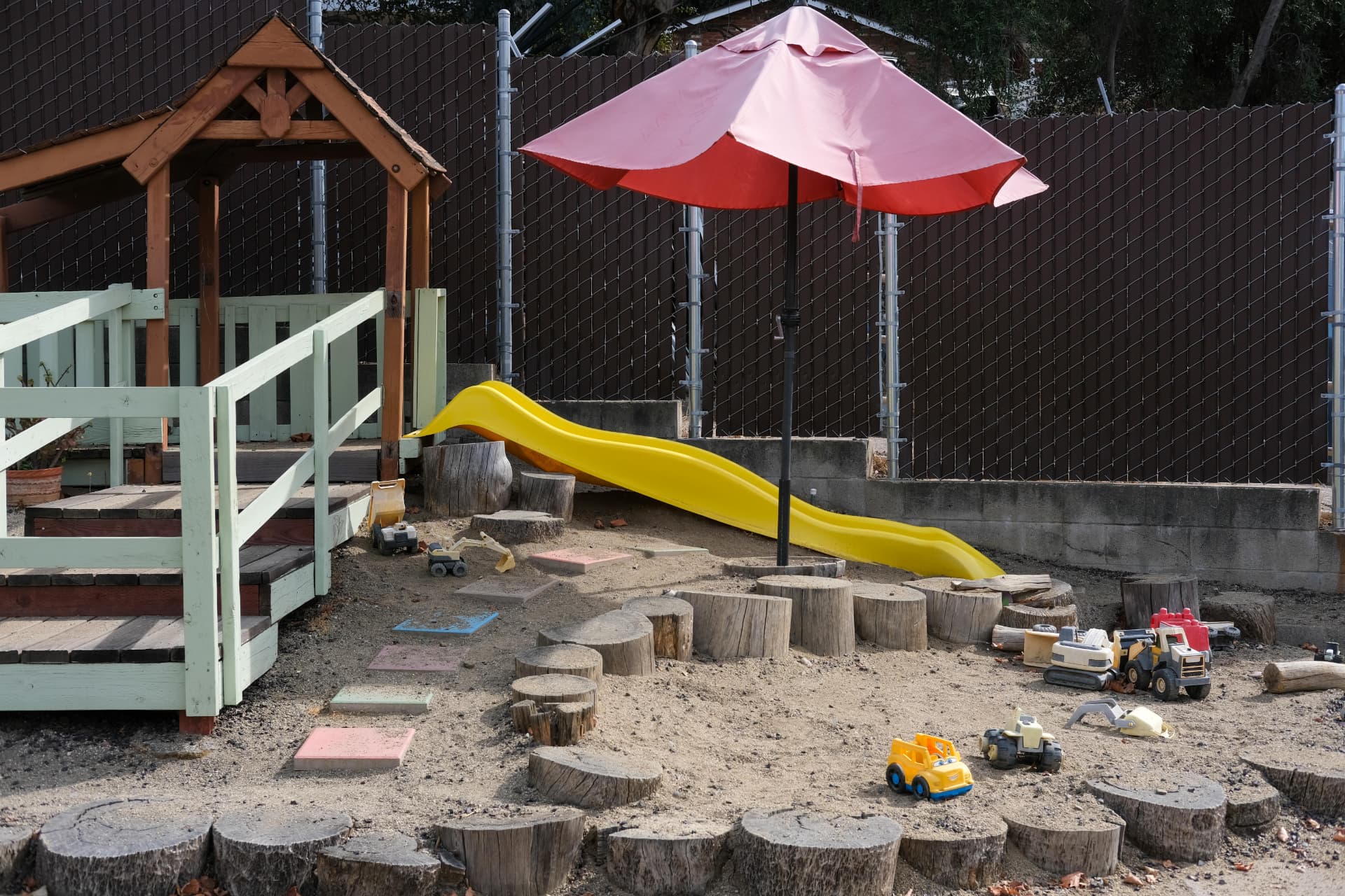 Our sandy playground with the yellow slide